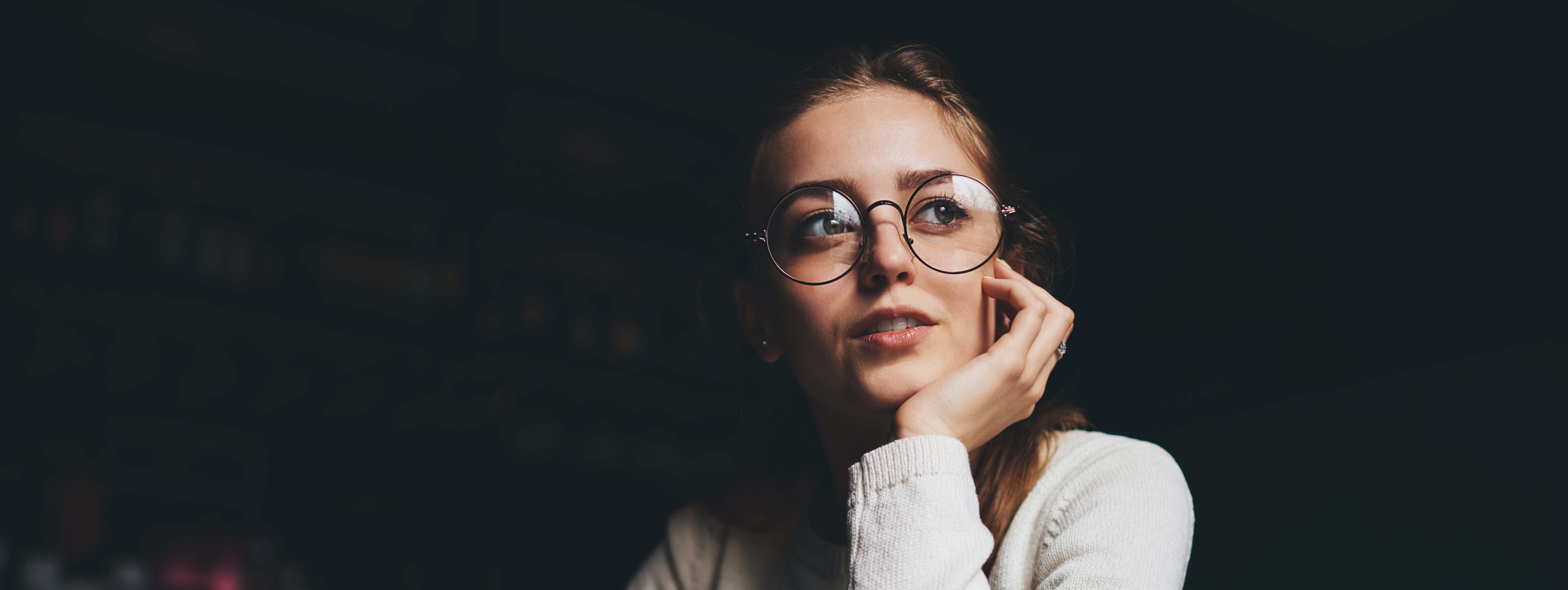 pensive female with glasses