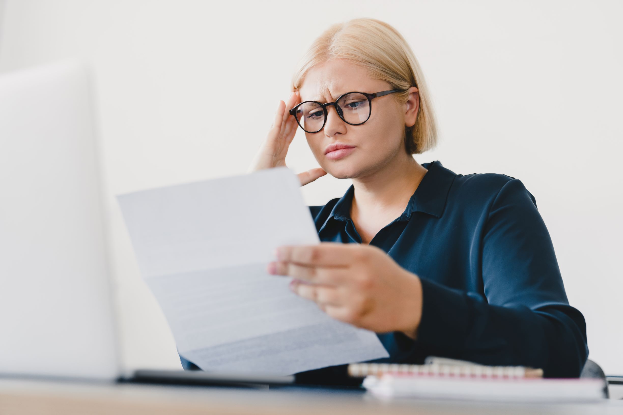 Woman looking at bills